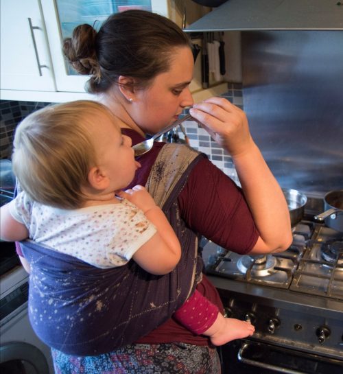 Babywearing while cooking. Chiara from Naturally Happy Families shares her top tips